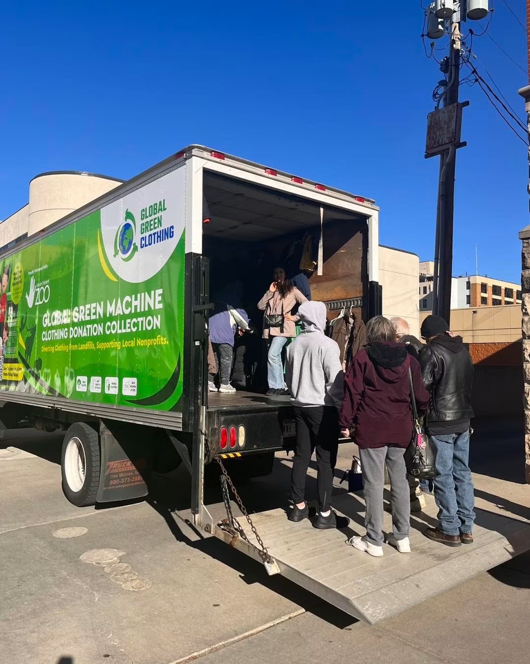 Community members loading donation bags at a Lincoln pop-up drive