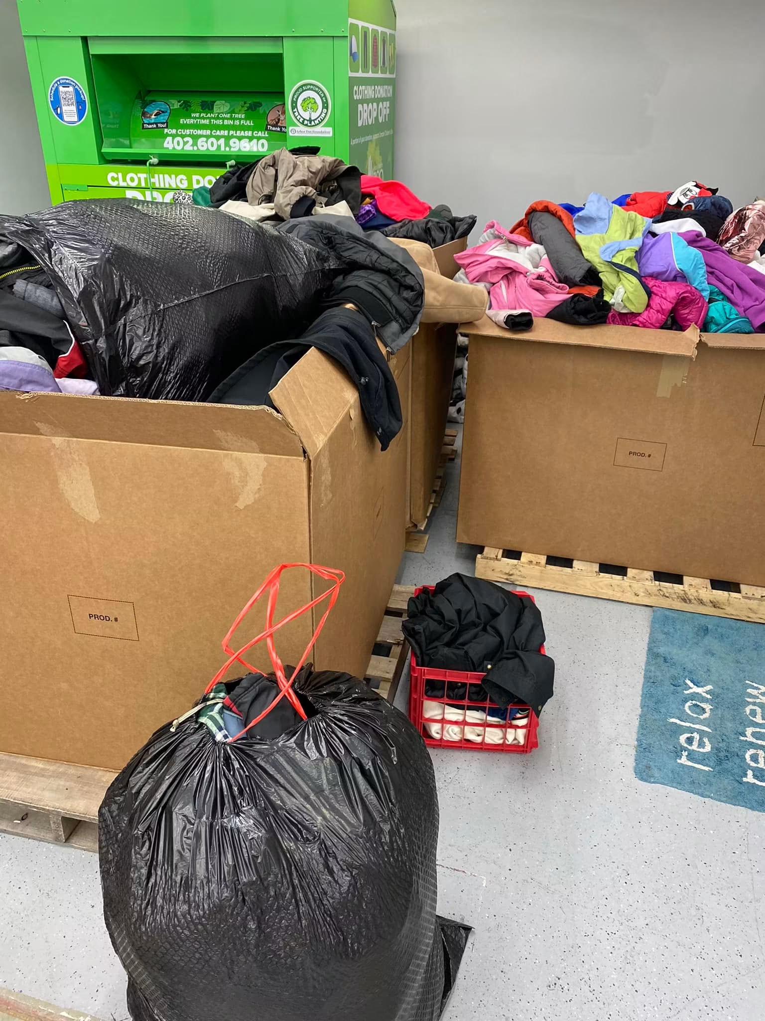 Boxes of sorted clothing donations at our facility
